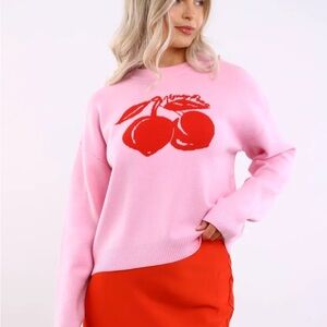 Noisy May Women’s Cera Cherry Knit Crewneck Sweater in pink with cherry graphic